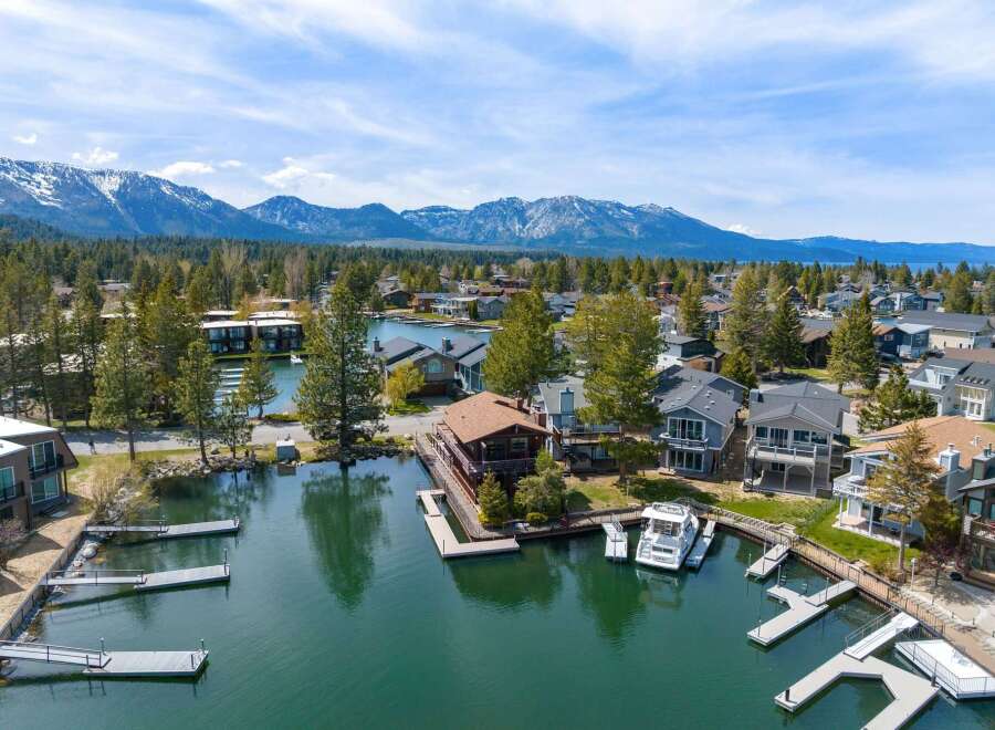 Discover waterfront living at its finest! This stunning property boasts a private dock, perfect for boating and enjoying the serene lake.