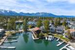 Discover waterfront living at its finest! This stunning property boasts a private dock, perfect for boating and enjoying the serene lake.