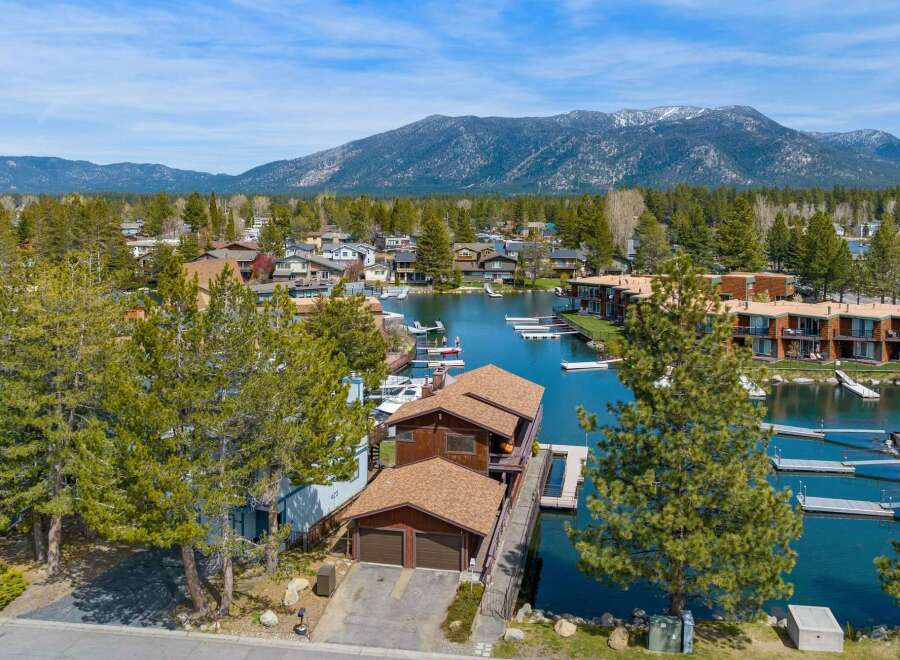 Discover waterfront living at its finest! This stunning property boasts a private dock, perfect for boating and enjoying the crystal-clear waters.