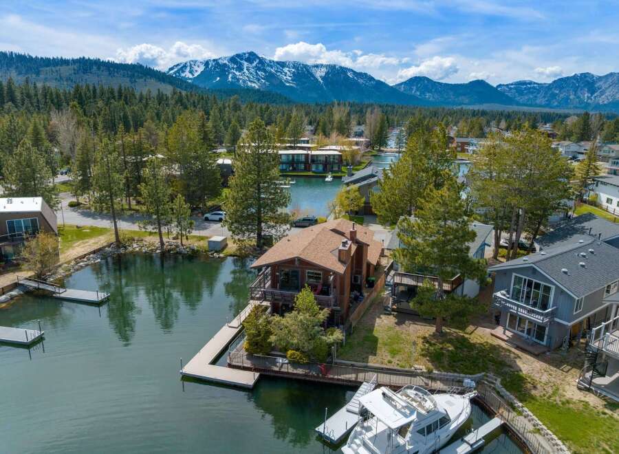 Discover waterfront living at its finest! This stunning property boasts a private dock, perfect for boating and enjoying the serene lake.