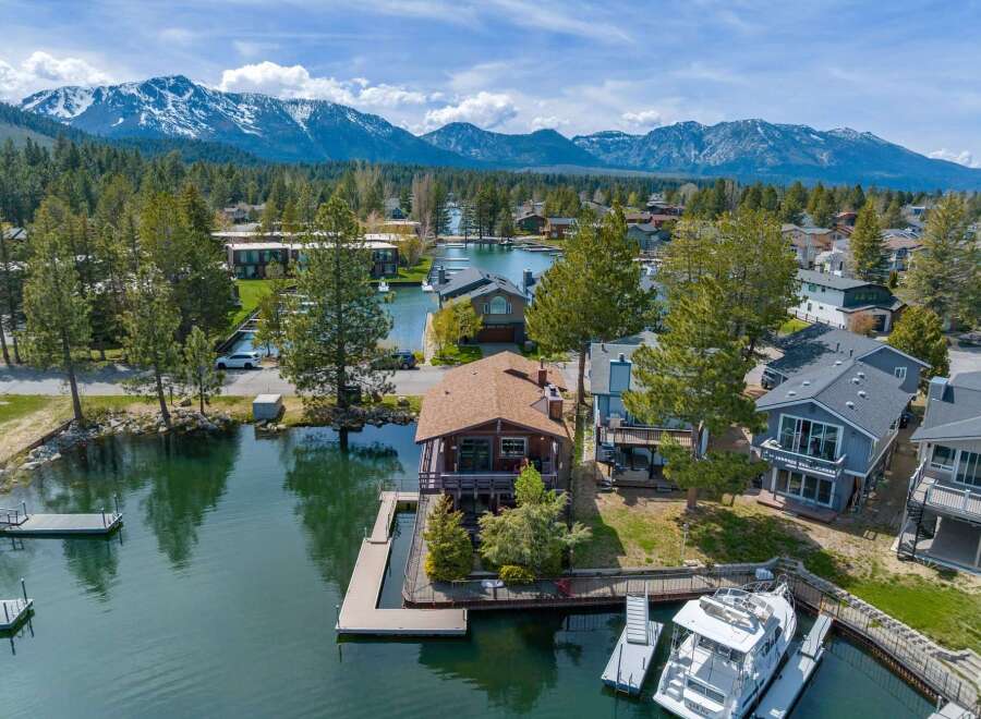 Discover waterfront living at its finest! This stunning property boasts a private dock, perfect for boating and enjoying the serene lake.
