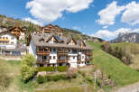 Discover a charming property nestled in a picturesque mountain setting.