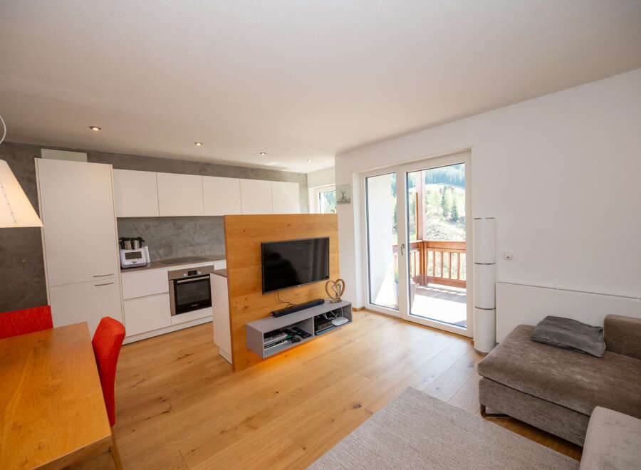 Discover modern living in this stunning property, featuring a stylish kitchen with sleek cabinetry and top-of-the-line appliances.