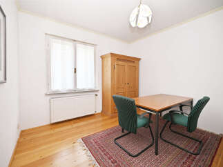 This charming property features a bright and airy dining area, perfect for enjoying meals.