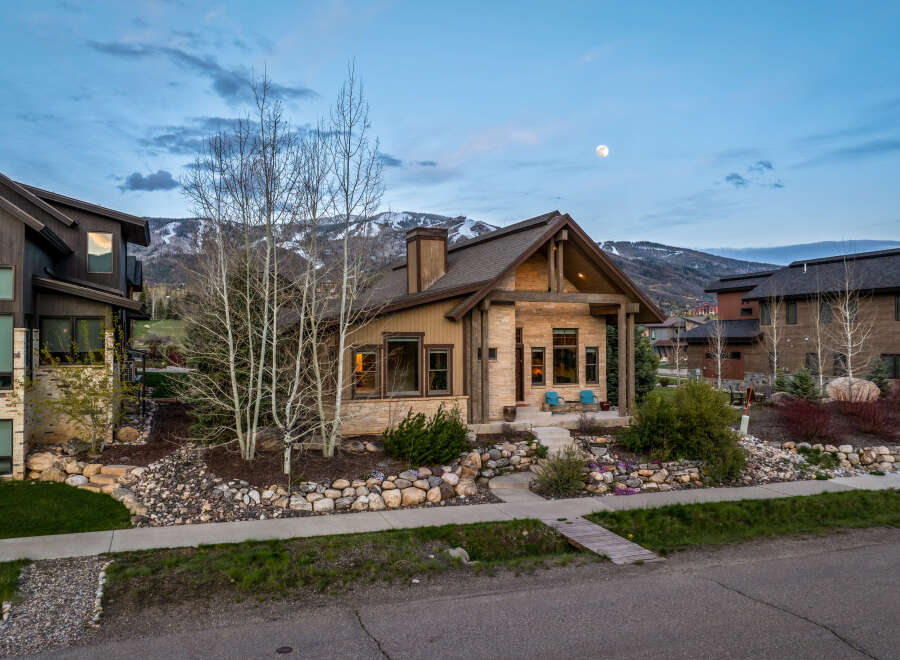 This stunning property boasts a beautiful exterior with a charming porch, perfect for enjoying the serene surroundings.