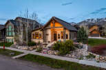 This stunning property boasts a beautiful exterior with a stone facade and a charming wooden door.