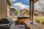 Enjoy outdoor living at its finest with this stunning property featuring a spacious patio and a luxurious hot tub.