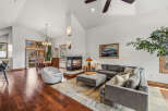 Step into luxury with this stunning living space, featuring a cozy fireplace and a modern sectional sofa.