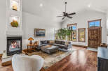 Step into luxury with this stunning living room, featuring a cozy fireplace and a stylish sectional sofa.