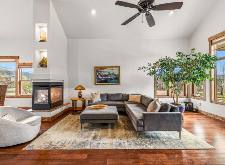 Step into luxury with this stunning living room featuring a cozy fireplace, perfect for chilly evenings.