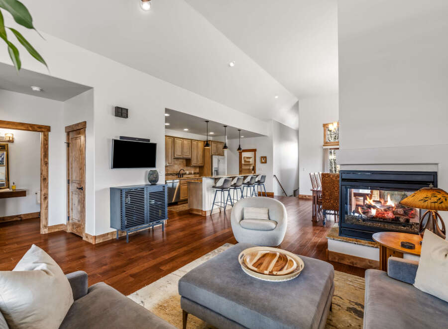 This stunning property boasts a cozy living room with a fireplace, perfect for relaxing evenings.