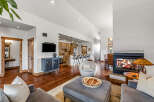 This stunning property boasts a cozy living room with a fireplace, perfect for relaxing evenings.