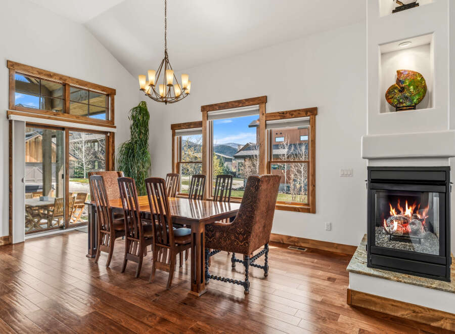 Step into luxury with this stunning dining room, featuring a beautiful wooden dining table and chairs, perfect for hosting gatherings.
