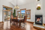 Step into luxury with this stunning dining room, featuring a beautiful wooden dining table and chairs, perfect for hosting gatherings.