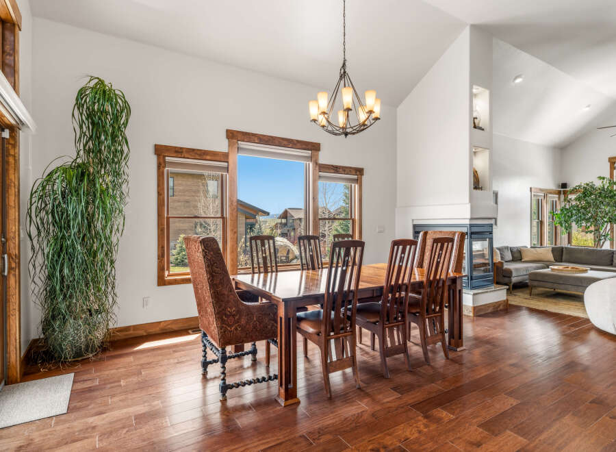This stunning dining room showcases a beautiful wooden dining table with seating for six, perfect for hosting gatherings.
