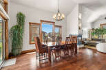 This stunning dining room showcases a beautiful wooden dining table with seating for six, perfect for hosting gatherings.