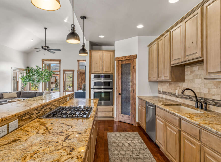This stunning kitchen boasts a spacious layout with a large island, perfect for entertaining.