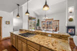 This stunning kitchen boasts a beautiful granite countertop, perfect for meal preparation and entertaining.