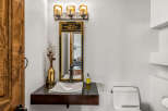 This stunning bathroom features a modern design with a sleek floating vanity and a stylish vessel sink.