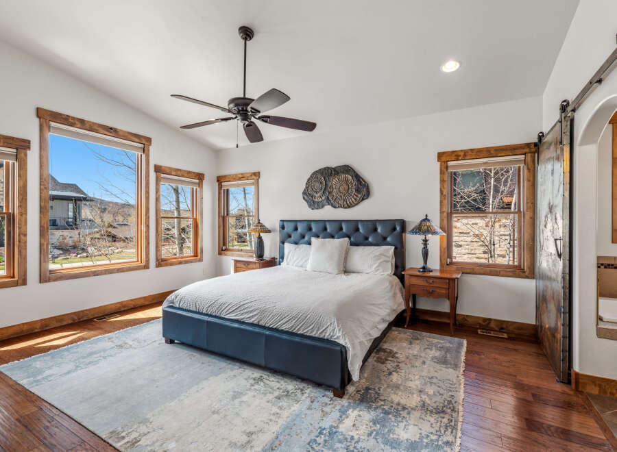 This stunning bedroom boasts a luxurious ambiance with its elegant design and high-end finishes.