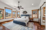 This stunning bedroom boasts a luxurious ambiance with its elegant design and high-end finishes.