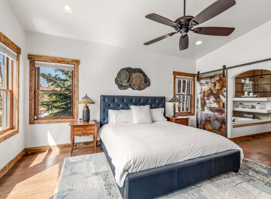 Step into luxury with this stunning bedroom, featuring a plush bed and elegant nightstands.