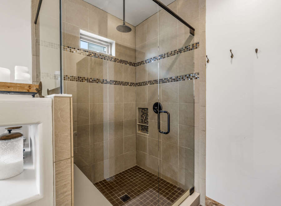 Step into a luxurious bathroom with a modern shower design.
