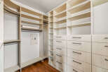 This custom-built closet offers ample storage and organization solutions.