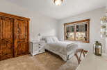 This charming bedroom features a cozy bed, perfect for a relaxing retreat.