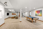 This spacious basement offers a perfect blend of relaxation and entertainment.