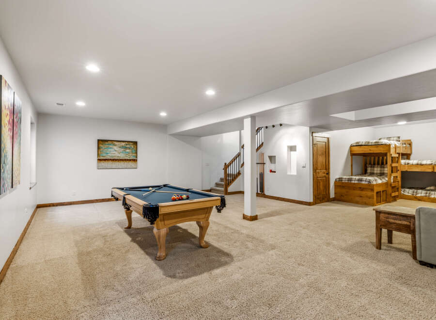 This spacious basement offers a perfect blend of recreation and relaxation.