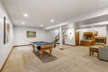 This spacious basement offers a perfect blend of recreation and relaxation.