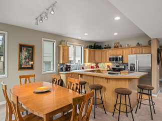 This stunning kitchen boasts a seamless blend of functionality and style, perfect for culinary enthusiasts.