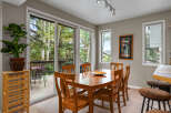 This stunning dining room offers a seamless blend of indoor and outdoor living.