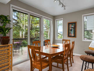 This stunning dining room offers a seamless blend of indoor and outdoor living.