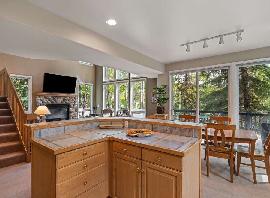 This stunning property boasts a spacious kitchen with ample counter space and cabinetry, perfect for culinary enthusiasts.