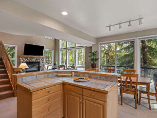 This stunning property boasts a spacious kitchen with ample counter space and cabinetry, perfect for culinary enthusiasts.