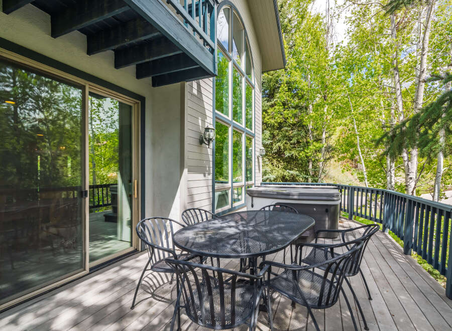 Enjoy the tranquility of this stunning property with a spacious deck, perfect for outdoor gatherings.