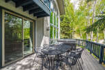 Enjoy the tranquility of this stunning property with a spacious deck, perfect for outdoor gatherings.
