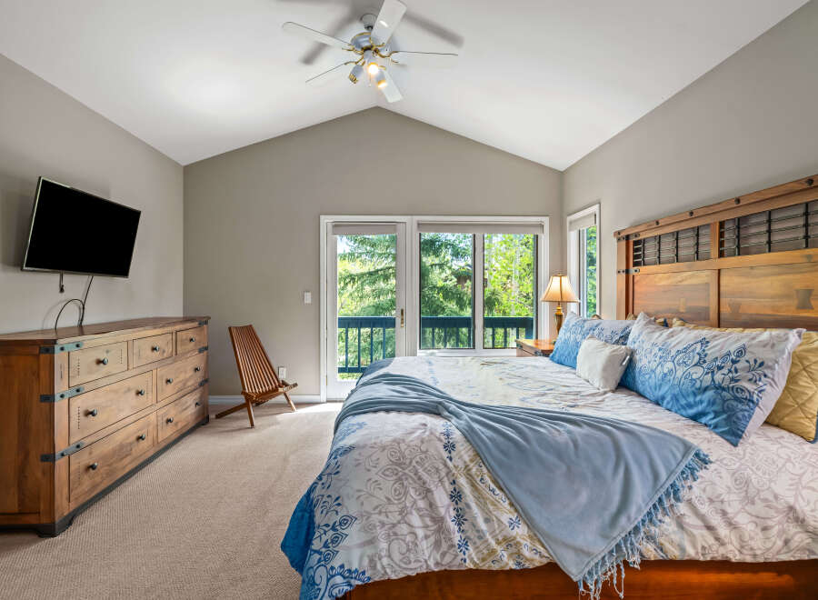 This stunning bedroom boasts a spacious layout and a serene atmosphere, perfect for relaxation.