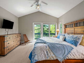 This stunning bedroom boasts a spacious layout and a serene atmosphere, perfect for relaxation.