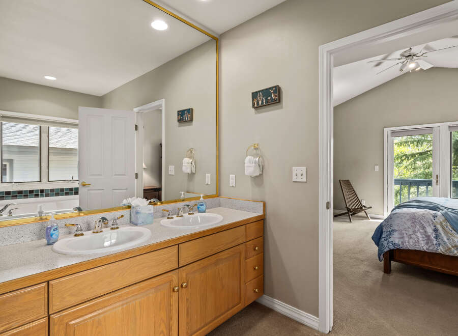 This inviting bathroom features a double vanity with ample counter space and stylish fixtures.