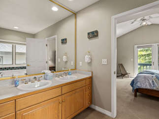This inviting bathroom features a double vanity with ample counter space and stylish fixtures.