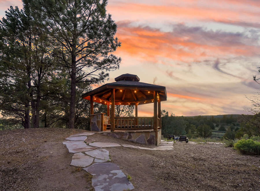Enjoy breathtaking sunsets from this charming gazebo, perfect for relaxing or entertaining.