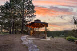Enjoy breathtaking sunsets from this charming gazebo, perfect for relaxing or entertaining.