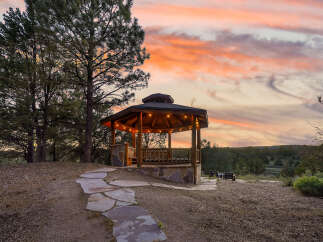 Enjoy breathtaking sunsets from this charming gazebo, perfect for relaxing or entertaining.