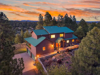 Nestled amidst a stunning natural landscape, this beautiful home offers a tranquil retreat.