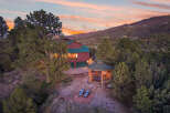 Escape to your dream home nestled in the mountains! This stunning property boasts a luxurious gazebo with a hot tub, perfect for relaxation.