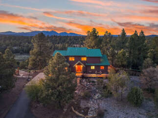 Nestled amidst the serene beauty of nature, this stunning property offers a perfect blend of luxury and tranquility.