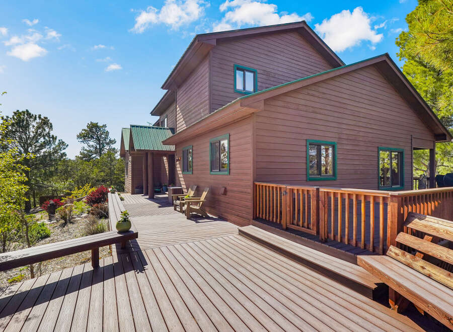 This stunning property boasts a beautiful wooden deck perfect for outdoor entertaining.